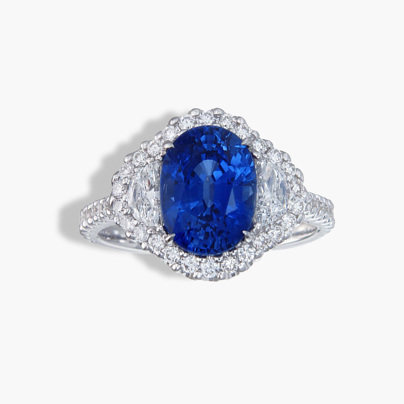 Private Label Blue Sapphire Oval Pave Halo Ring in 18K White Gold