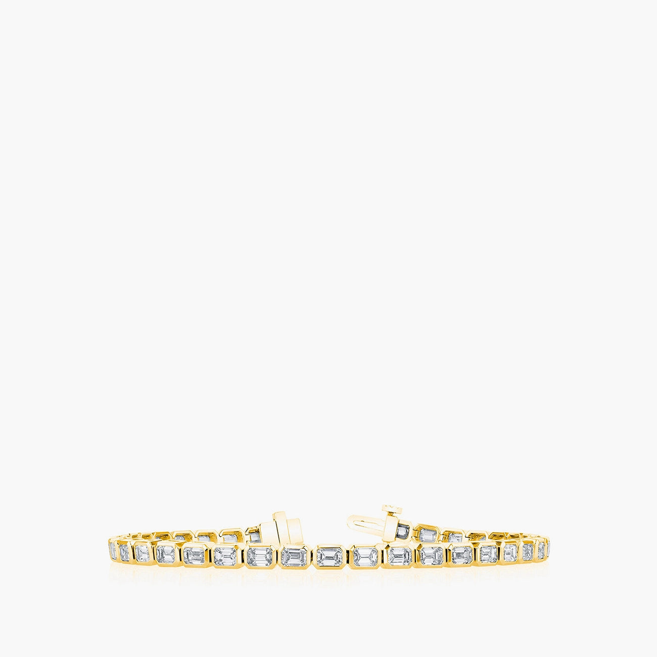 East-west emerald diamond tennis bracelet in 18K yellow gold with 7.4ct diamonds, top view