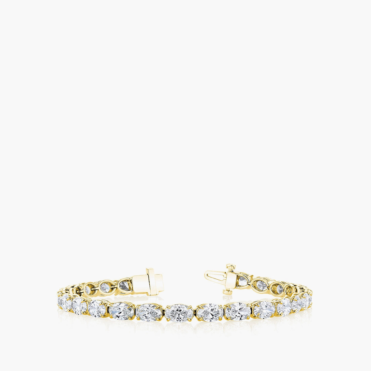 East-west oval-cut diamond tennis bracelet in 18K yellow gold, front view