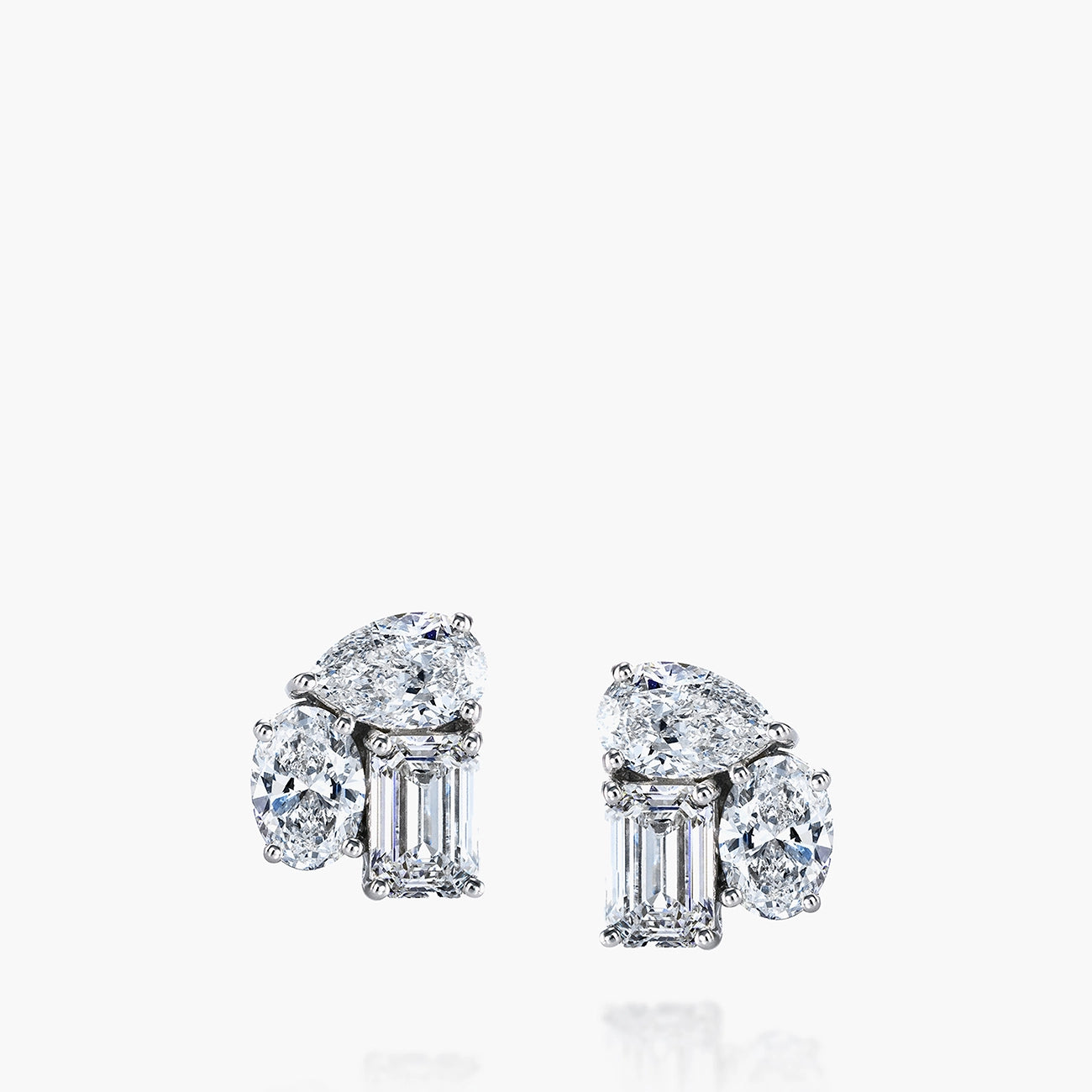 Emerald, pear and oval diamond cluster stud earrings in 18K white gold, front view
