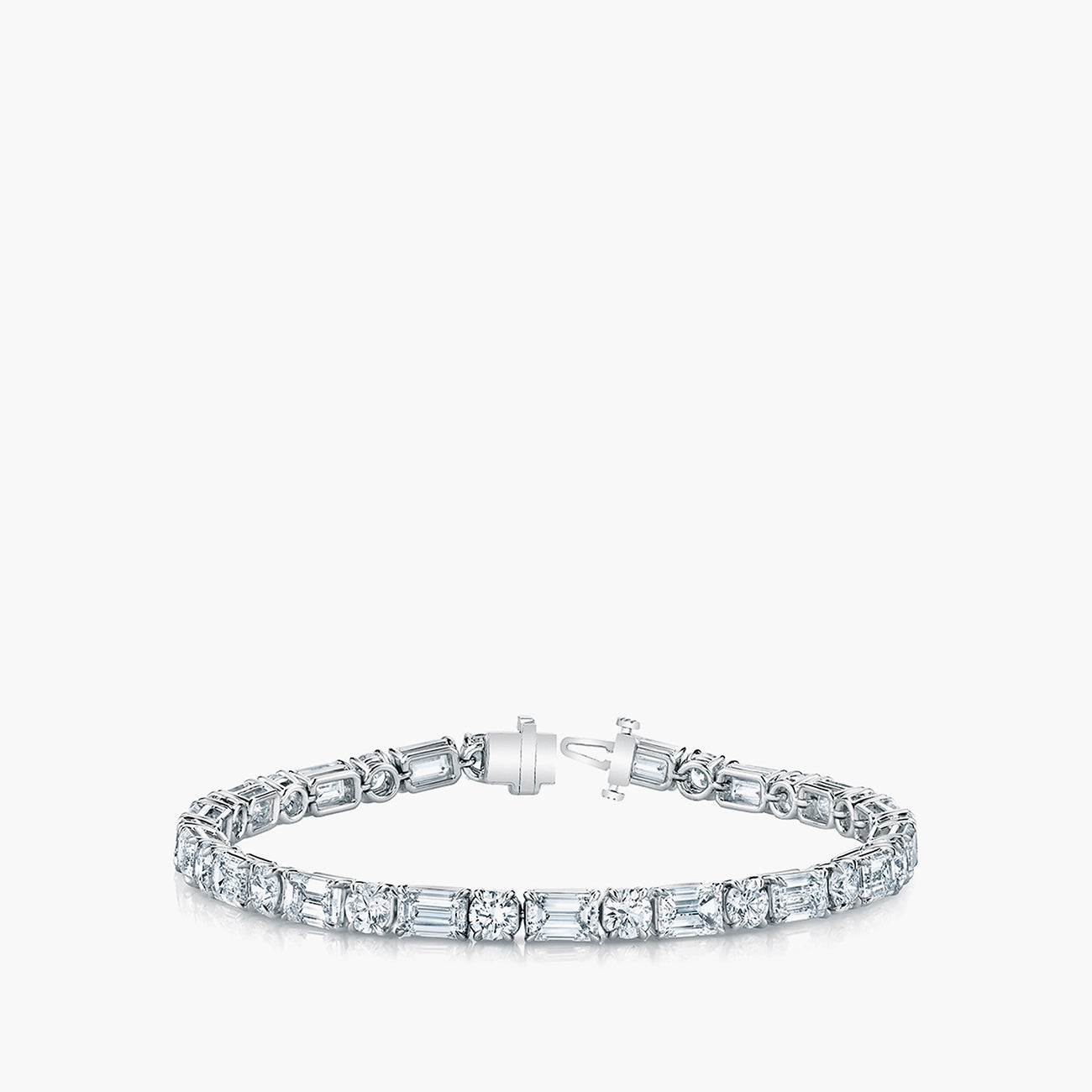 Emerald and round diamond tennis bracelet in platinum with 7.7ct diamonds, front view