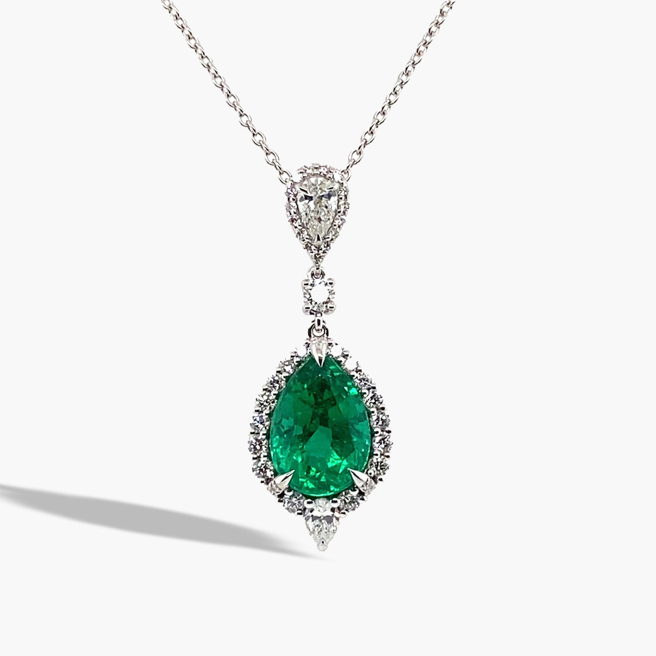 Private Label Pear-Shaped Emerald and Diamond Halo Necklace in 18K White Gold