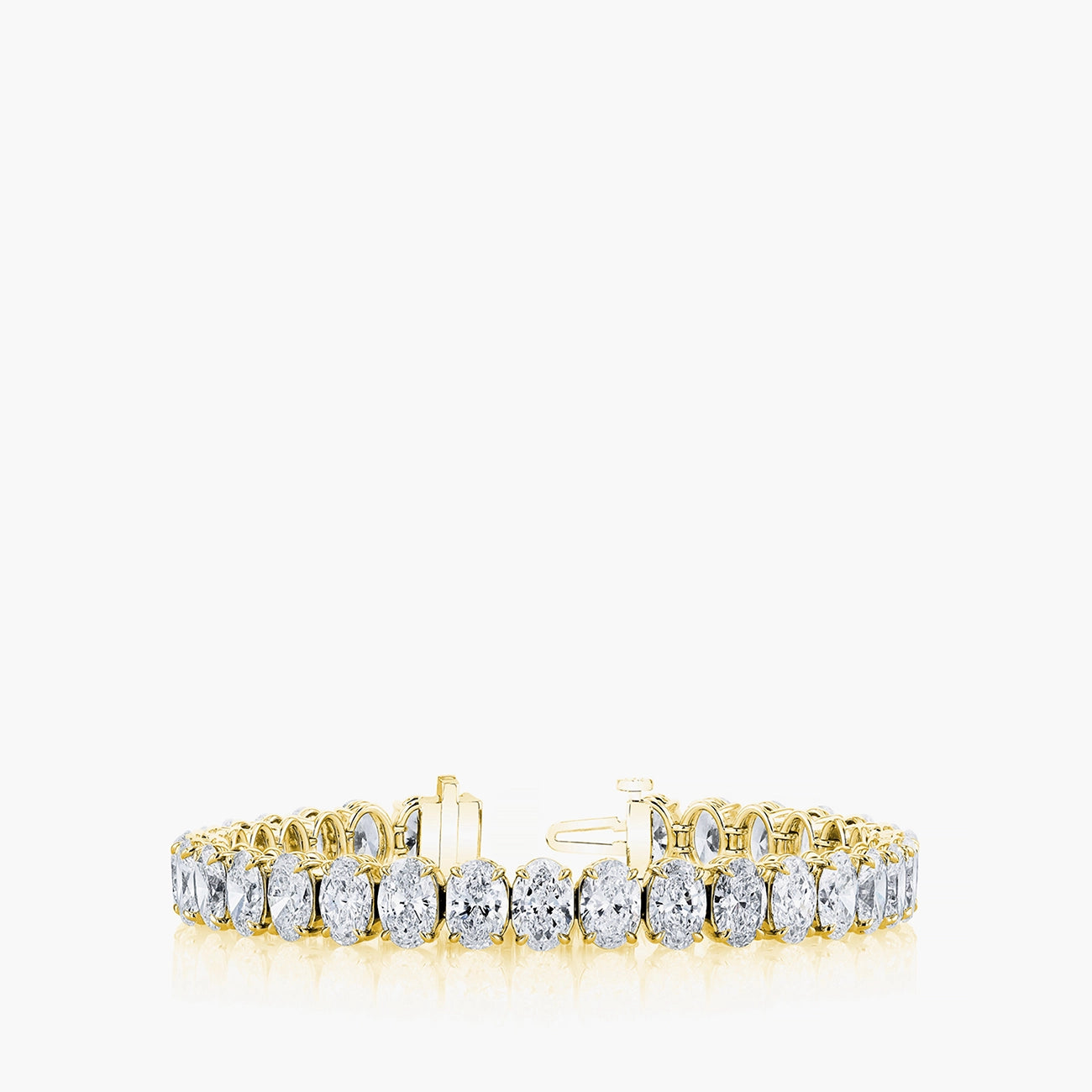 North-south oval diamond tennis bracelet in 18K yellow gold with 6.4ct diamonds, front view