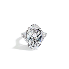 11 Carat Diamond Oval and Side Stone Ring