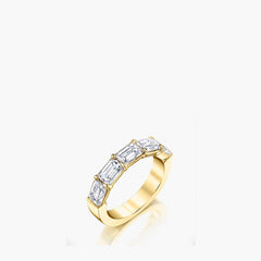 East-west emerald-cut diamond band in 18K yellow gold, top-down view