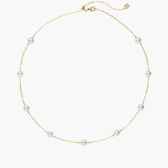 Mikimoto Akoya pearl necklace featuring eight gray cultured pearls evenly spaced along an 18k yellow gold chain with a lobster clasp closure