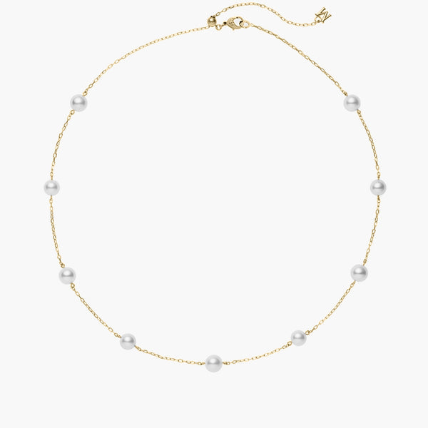Mikimoto Akoya pearl necklace featuring eight gray cultured pearls evenly spaced along an 18k yellow gold chain with a lobster clasp closure