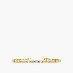East-west emerald diamond tennis bracelet in 18K yellow gold, front view