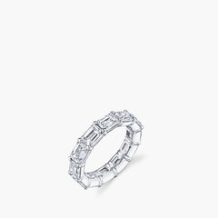 East-west emerald diamond eternity band in platinum showing 360-degree setting, top view