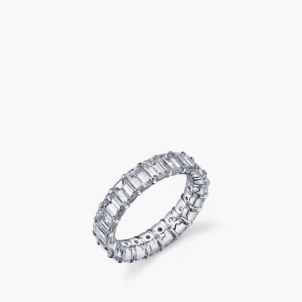 Larger emerald-cut diamond eternity band in platinum showing 360-degree setting, top view