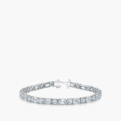 Emerald and round diamond tennis bracelet in platinum with 7.7ct diamonds, front view
