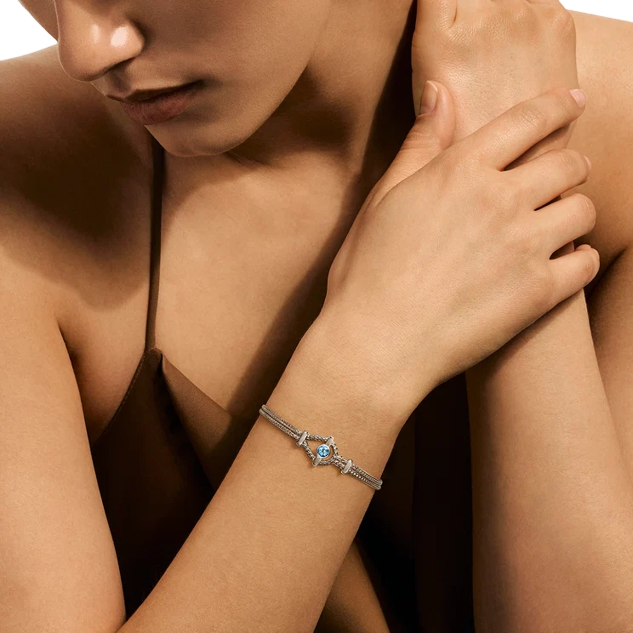 John Hardy Icon Bracelet in sterling silver with Swiss blue topaz, worn on wrist