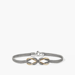 Mixed metal silver and gold woven mesh bracelet with ornate bow centerpiece