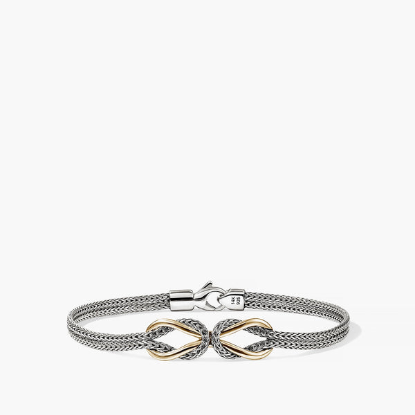 Mixed metal silver and gold woven mesh bracelet with ornate bow centerpiece