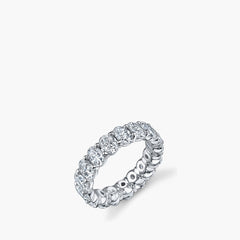 Larger oval diamond eternity band in platinum showing 360-degree setting, top view