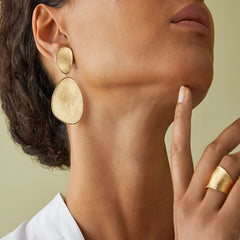 Marco Bicego Lunaria 18K Yellow Gold Petal Earrings on a woman