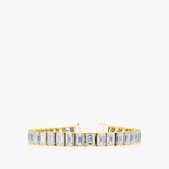 North-south oval diamond tennis bracelet in 18K yellow gold with 7-inch length, front view