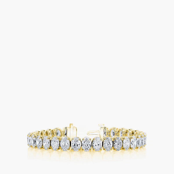 North-south oval diamond tennis bracelet in 18K yellow gold with 6.4ct diamonds, front view