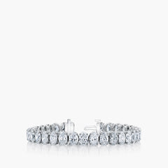 North-south oval diamond tennis bracelet in 18K white gold with 6.4ct diamonds, front view