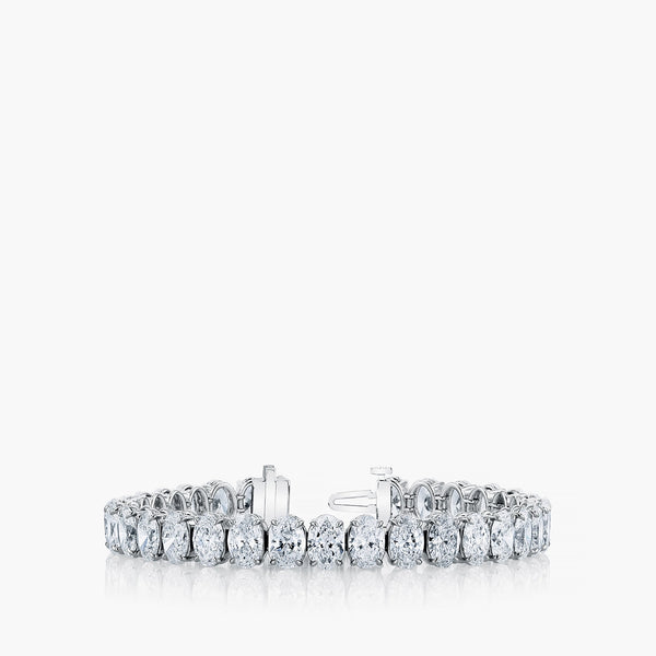 North-south oval diamond tennis bracelet in 18K white gold with 6.4ct diamonds, front view