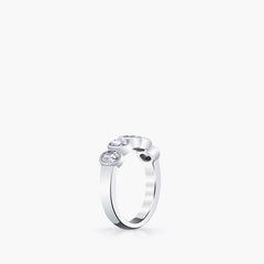 Oval diamond band side profile showing bezel-set stones in platinum