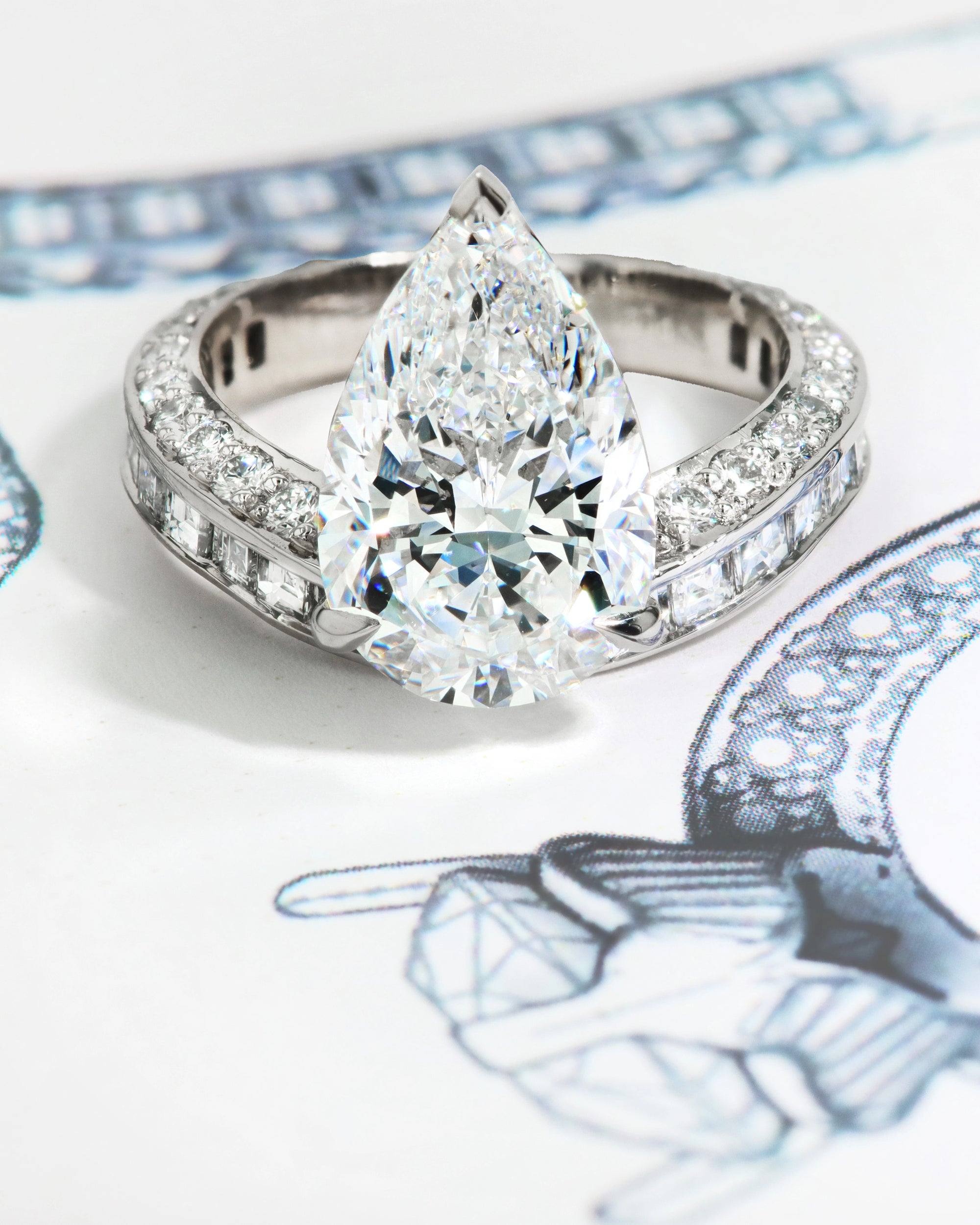 A custom designed Robert Pelliccia Original ring with an Origin Pear Shape Diamond