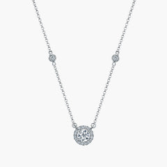 Round diamond halo pendant in 18K white gold, front view