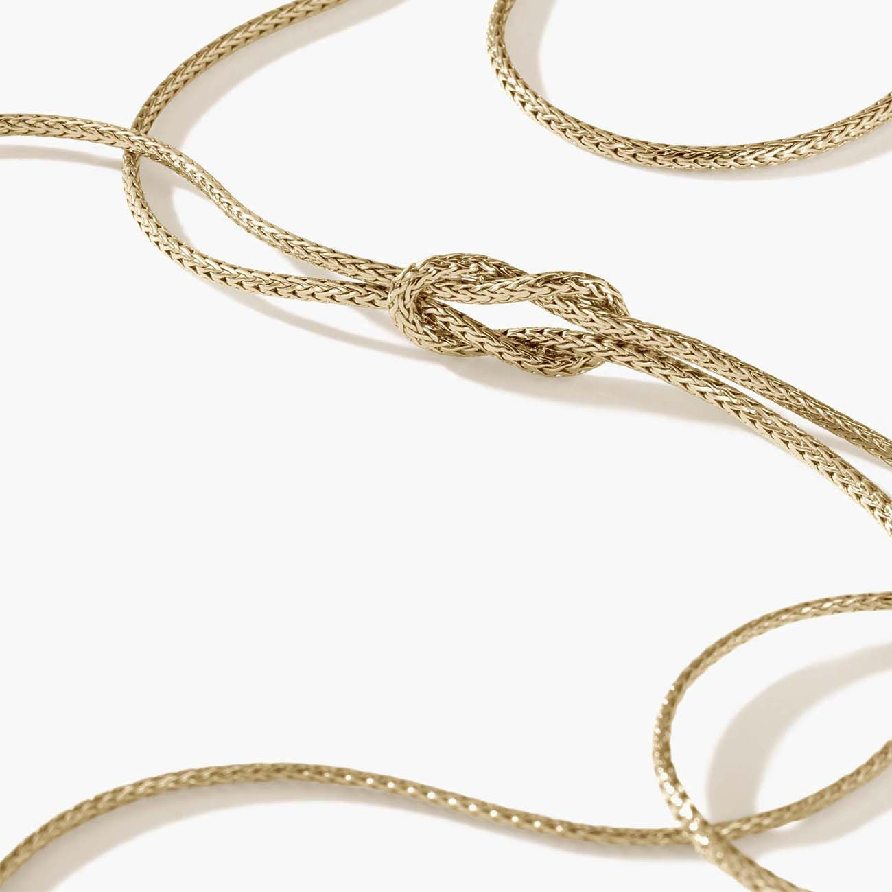 Manah Gold love knot chain Closeup